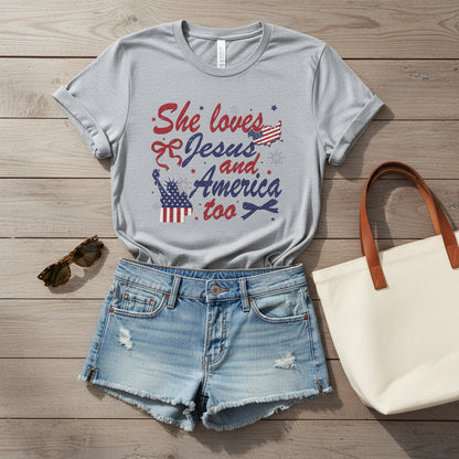 Gray t-shirt with 'She loves Jesus and America too' text and graphics on a white background