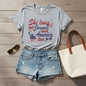 Gray t-shirt with 'She loves Jesus and America too' text and graphics on a white background